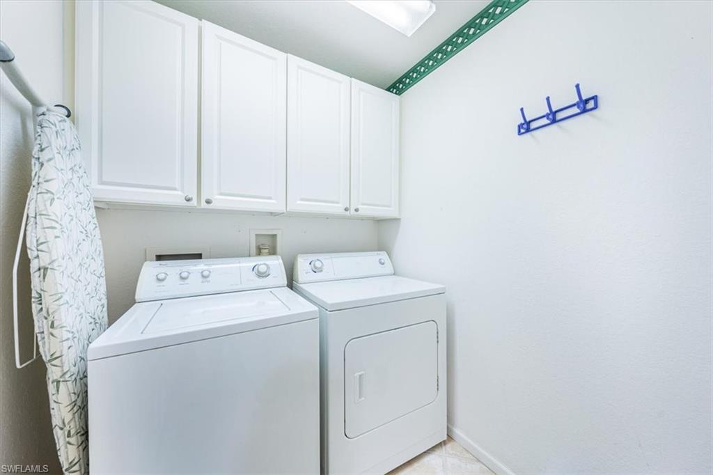7120 Timberland Circle, Unit 101 Naples, FL 34109 - Photo 22 of 24 a view of storage and utility room with washer and dryer