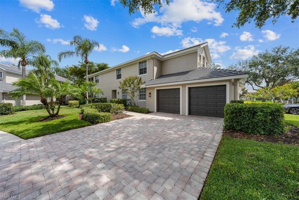 7120 Timberland Circle, Unit 101 Naples, FL 34109 - Photo 23 of 24 a view of a house with a yard