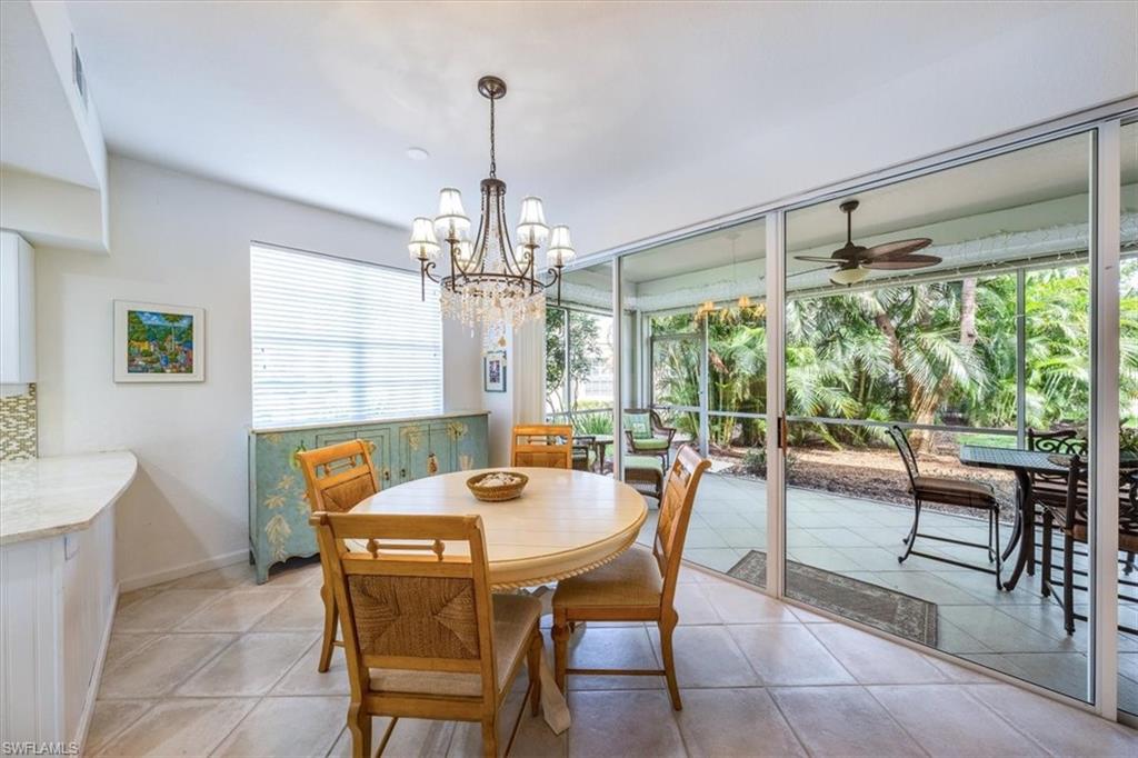 7120 Timberland Circle, Unit 101 Naples, FL 34109 - Photo 9 of 24 a view of a dining room with furniture window and outside view