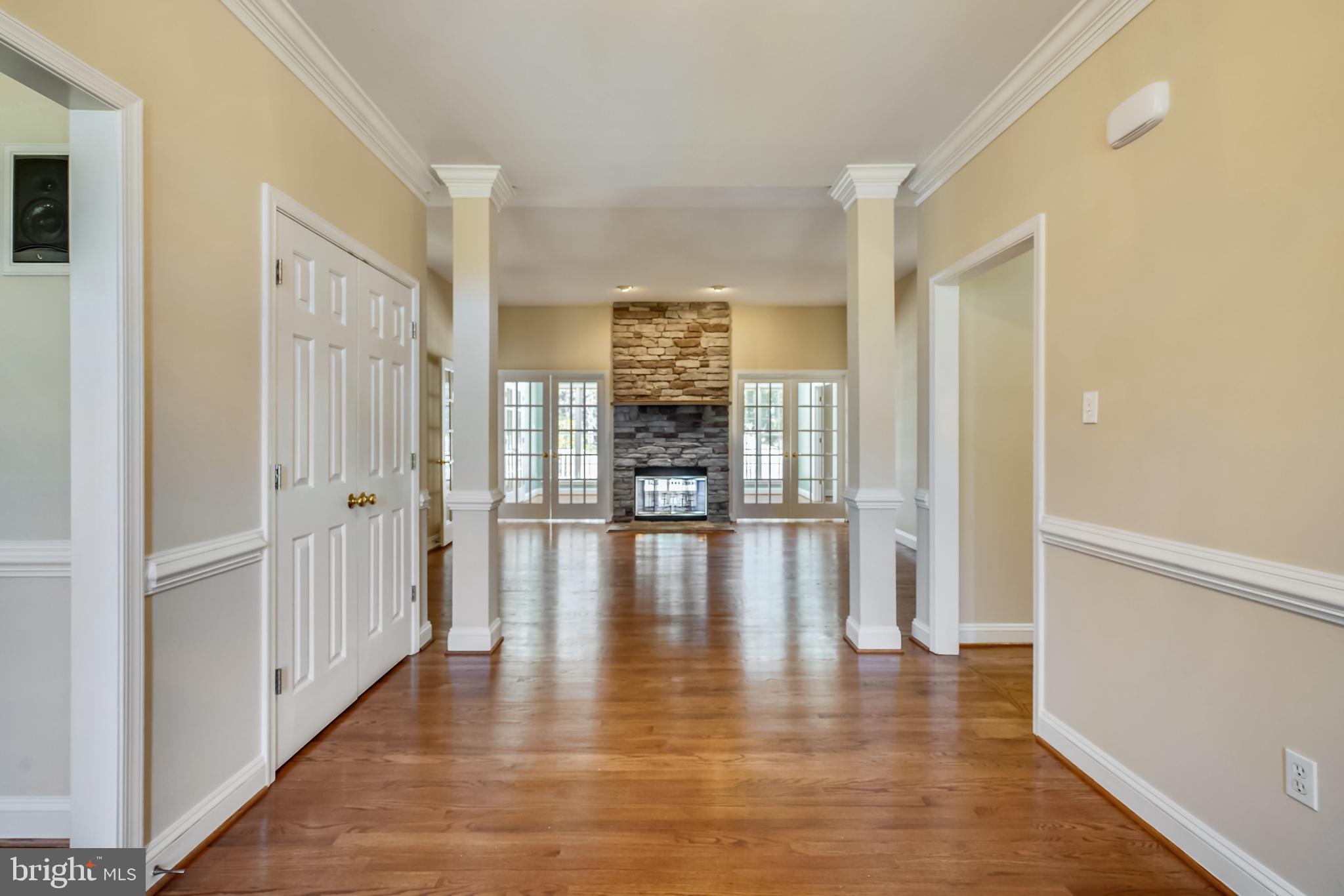 11862 Simpson Road Clarksville, MD 21029 - Photo 6 of 58 Dramatic Foyer entry with view of LR and stone FP