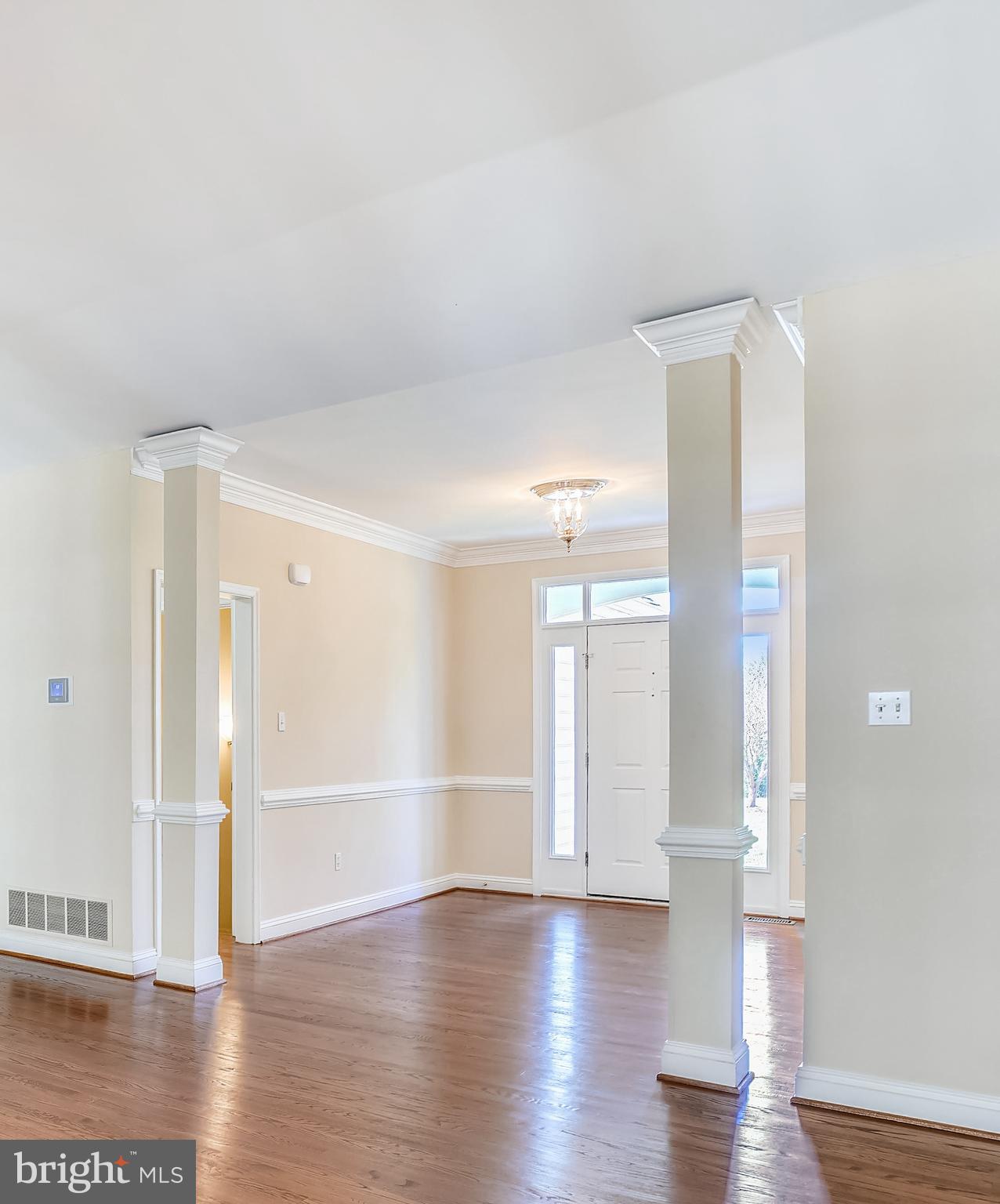 11862 Simpson Road Clarksville, MD 21029 - Photo 7 of 58 Foyer entry with chair & crown molding