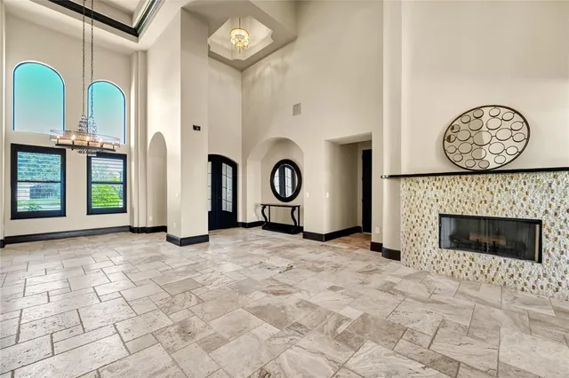 a view of yard with swimming pool and tall trees