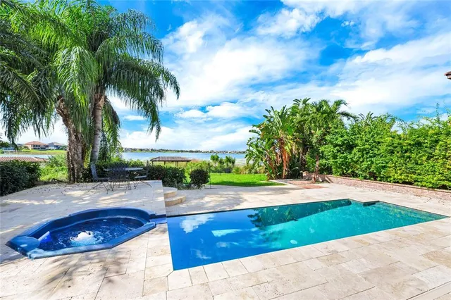 a living room with furniture ceiling fan and a rug