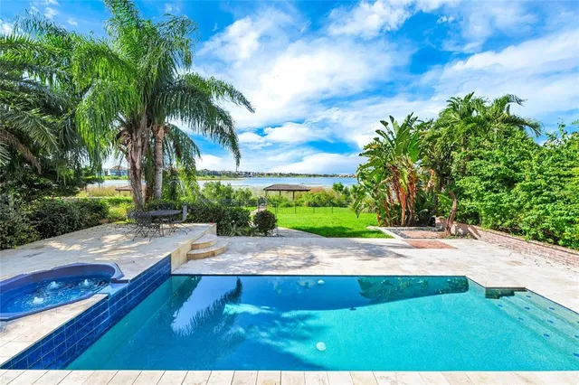 a bedroom with a bed and flat screen tv