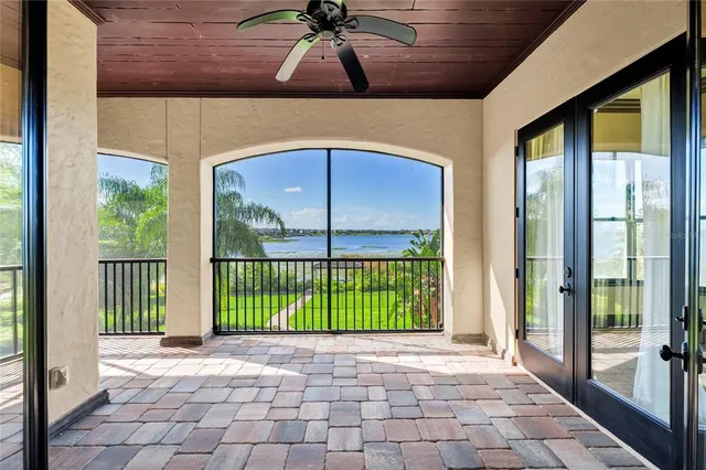 an aerial view of a house with a lake view