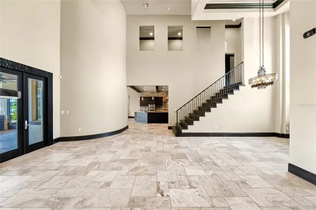 a kitchen with stainless steel appliances granite countertop a sink and a stove