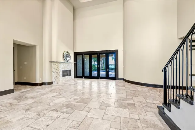 a kitchen with stainless steel appliances granite countertop a sink and a refrigerator