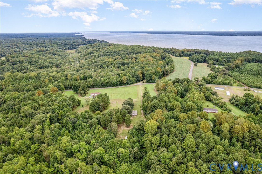 1292 Mt Prospect Road Laneview, VA 22504 - Photo 23 of 25 a view of a lake with a building in the background