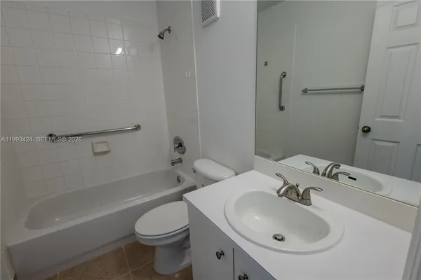 a bathroom with a toilet and a sink