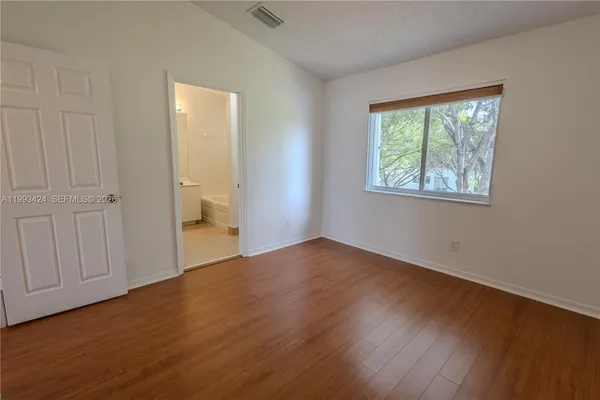 a view of staircase with white walls and stairs