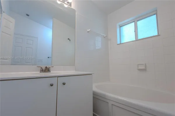 an aerial view of a house with a lake view