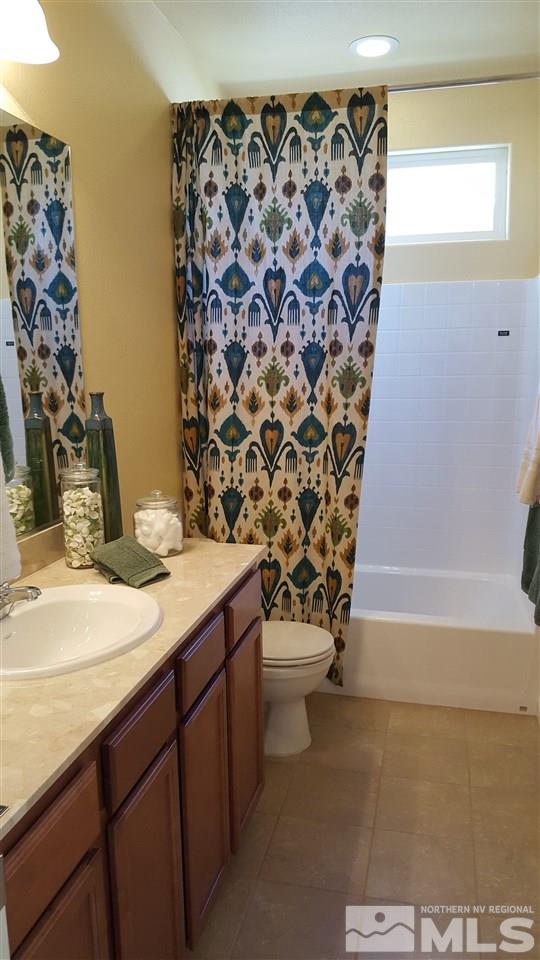 2375 Soprano Drive Reno, NV 89521 - Photo 4 of 6 a bathroom with a sink toilet and shower