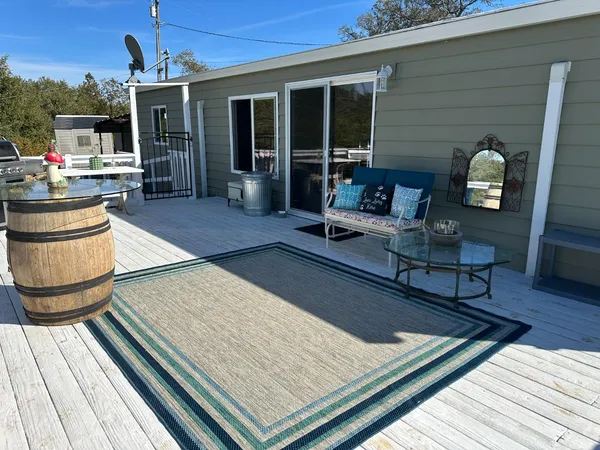 a view of a chairs and tables in the balcony