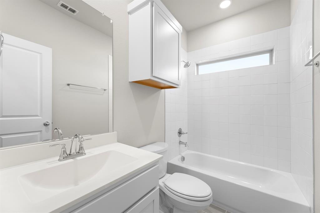 2359 Bell Way Forney, TX 75126 - Photo 27 of 31 a bathroom with a sink a toilet and a bathtub