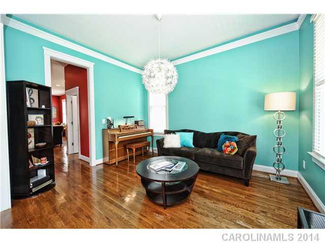 1862 2nd Baxter Crossing Fort Mill, SC 29708 - Photo 5 of 16 a living room with furniture a table and a chandelier