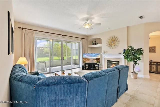 a view of a porch with furniture and garden