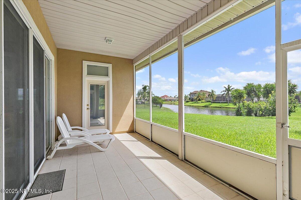 4907 Reed Island Trail Jacksonville, FL 32225 - Photo 13 of 25 a view of a porch with furniture and garden