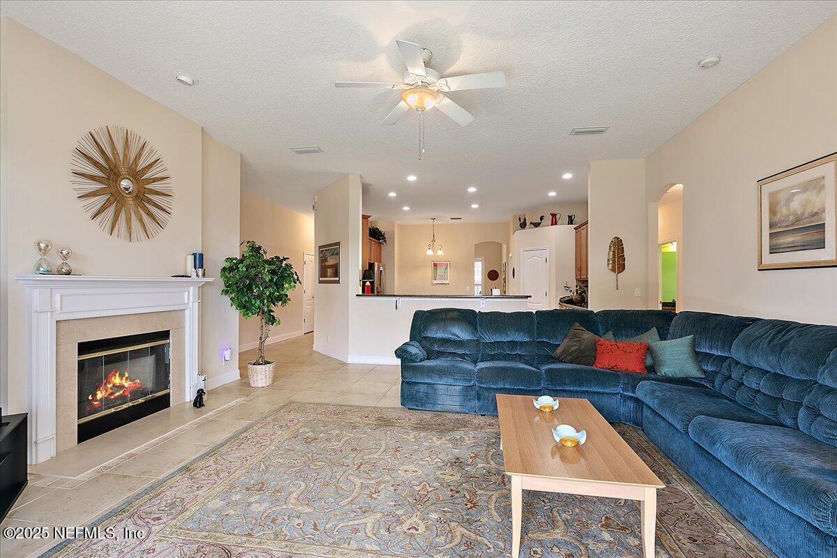 4907 Reed Island Trail Jacksonville, FL 32225 - Photo 15 of 25 a living room with furniture and a fireplace