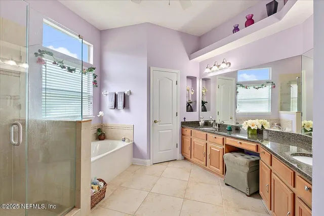 a bathroom with a bathtub and a shower