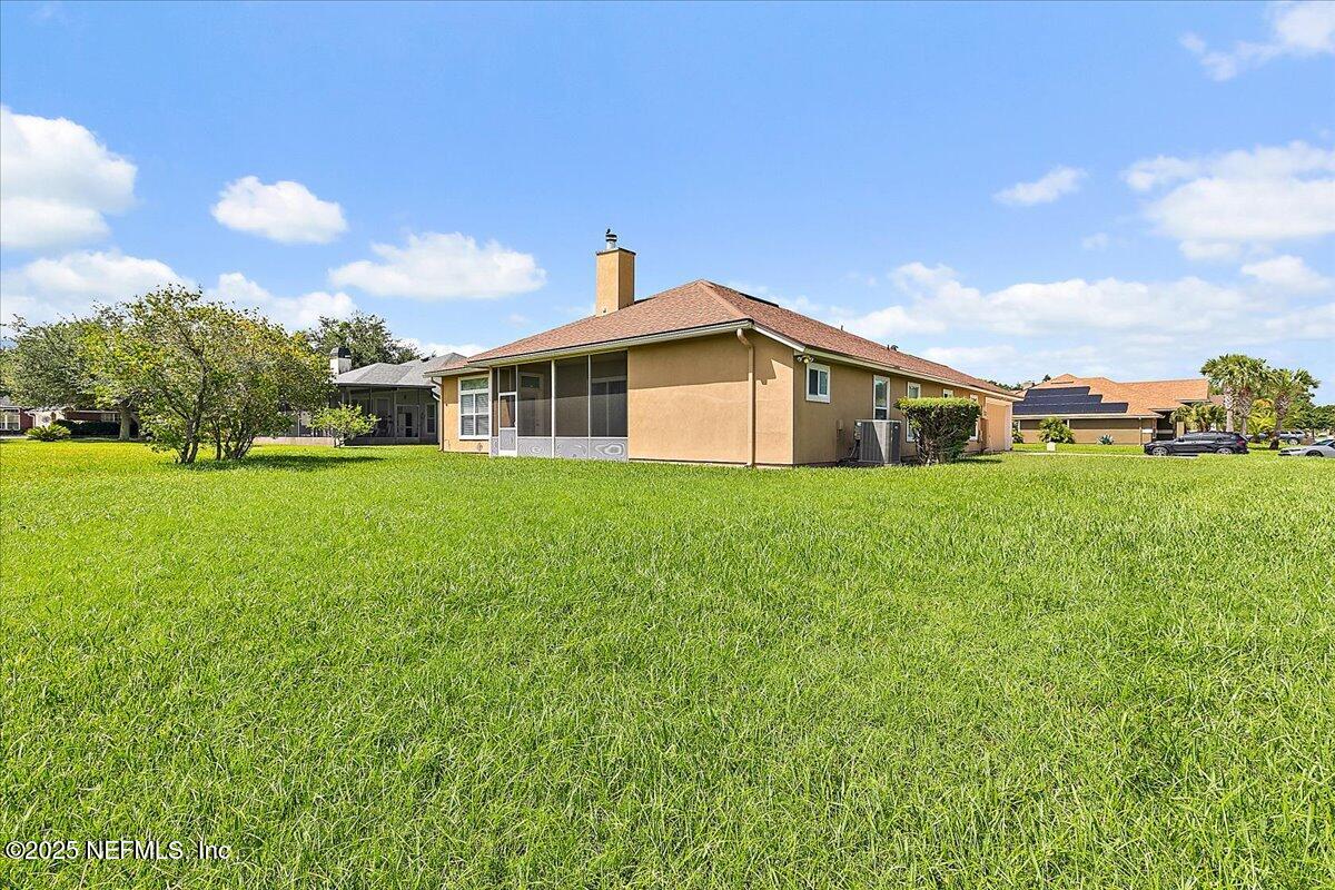4907 Reed Island Trail Jacksonville, FL 32225 - Photo 24 of 25 a view of a house with a big yard