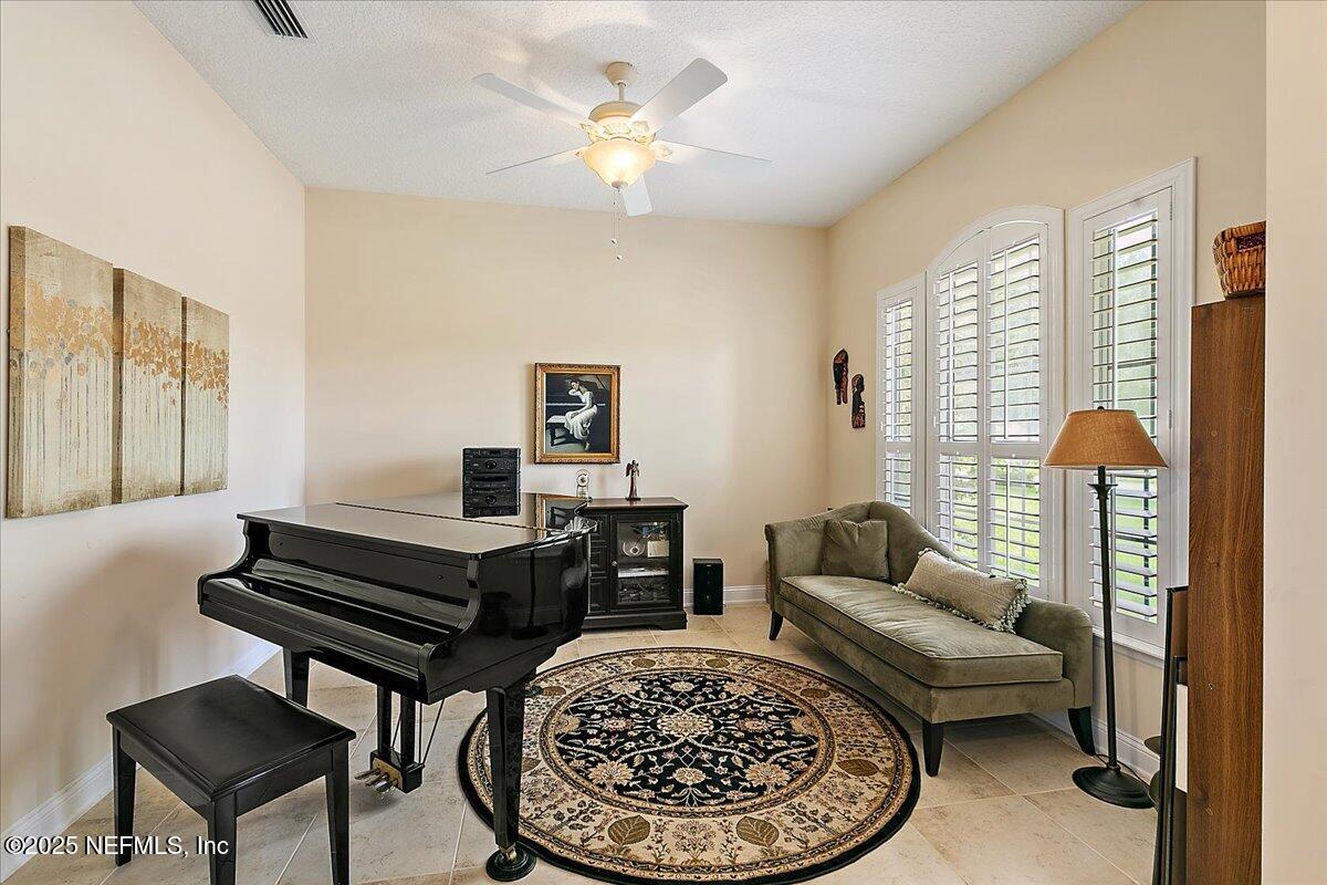 4907 Reed Island Trail Jacksonville, FL 32225 - Photo 5 of 25 a living room with furniture a rug and a window