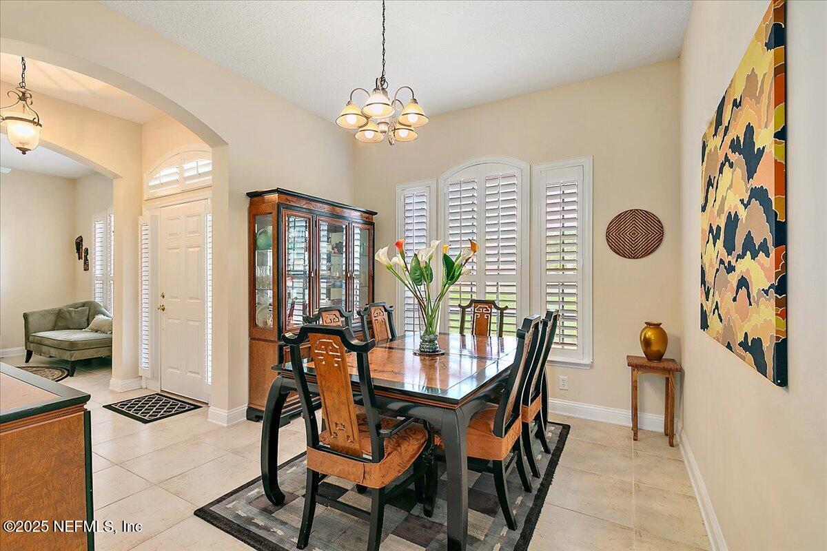 4907 Reed Island Trail Jacksonville, FL 32225 - Photo 7 of 25 a dining room with furniture and window