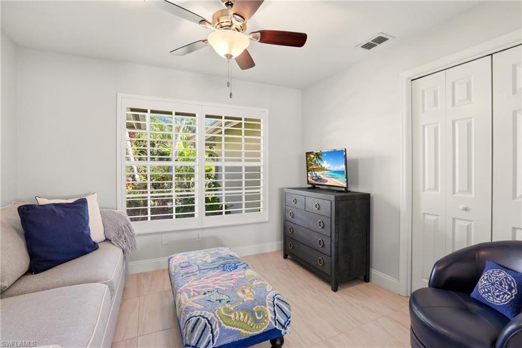 4282 Longshore Way North Naples, FL 34119 - Photo 16 of 43 Sitting room featuring ceiling fan and baseboards