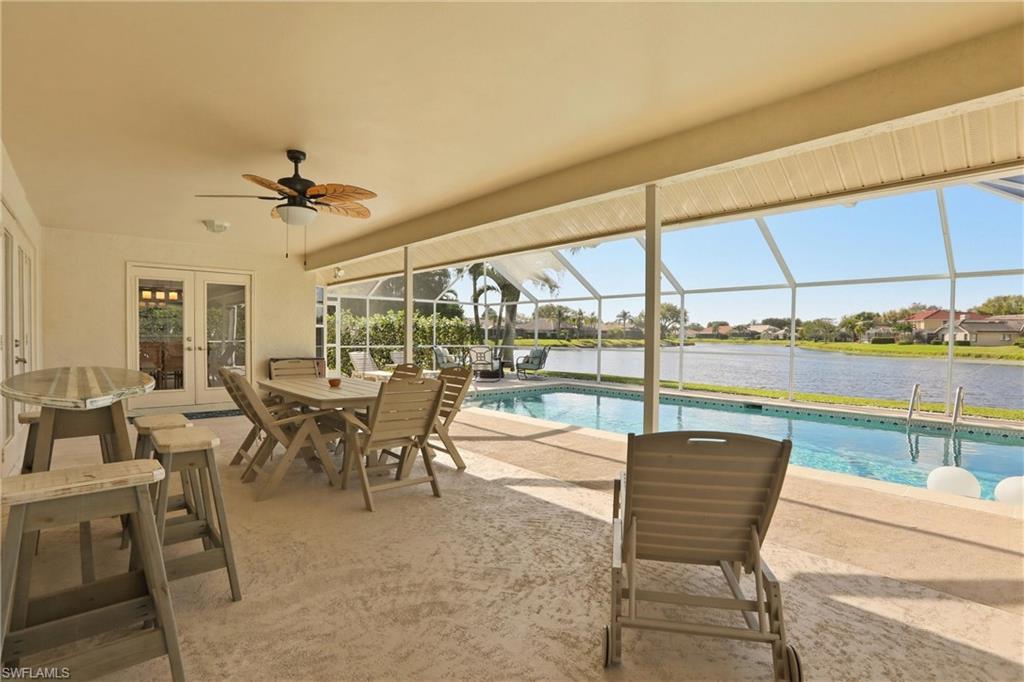 4282 Longshore Way North Naples, FL 34119 - Photo 32 of 43 Outdoor pool featuring french doors, a patio, a sunroom, a lanai, and outdoor dining space
