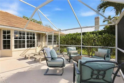 a view of a swimming pool with a porch