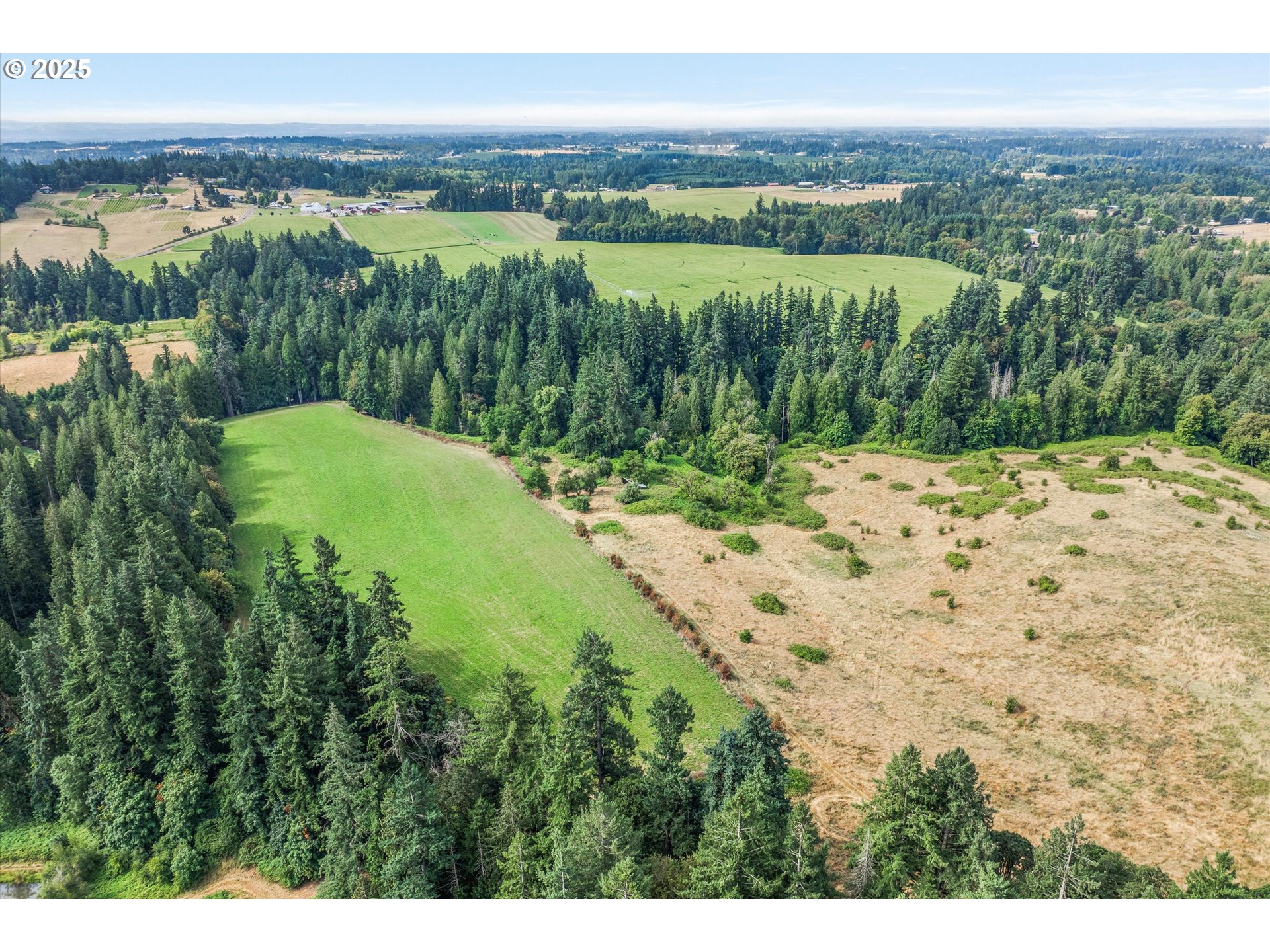 21303 South Central Point Road Oregon City, OR 97045 - Photo 13 of 48 a view of a lake with a yard
