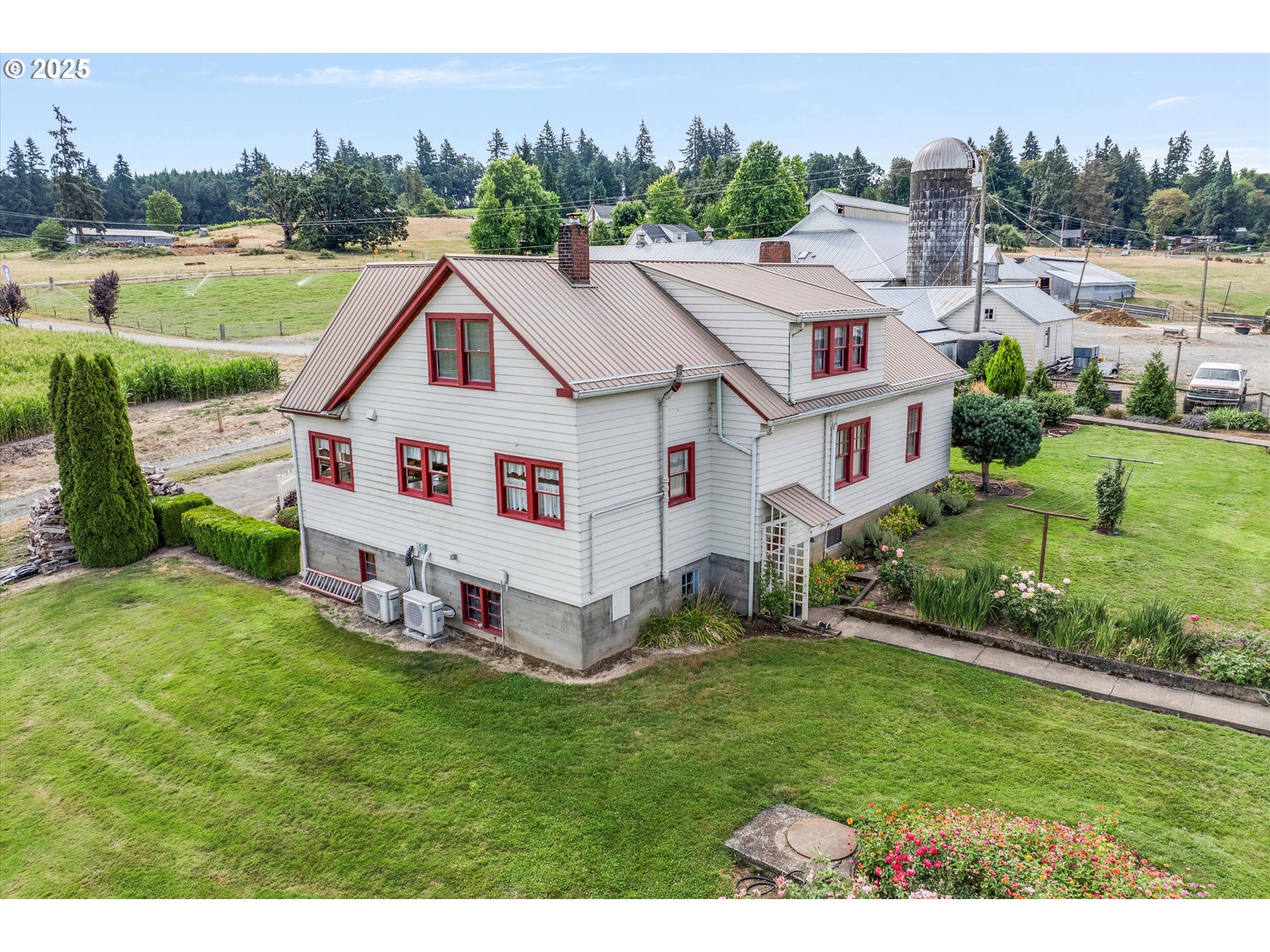 21303 South Central Point Road Oregon City, OR 97045 - Photo 34 of 48 a aerial view of a house with a yard table and chairs