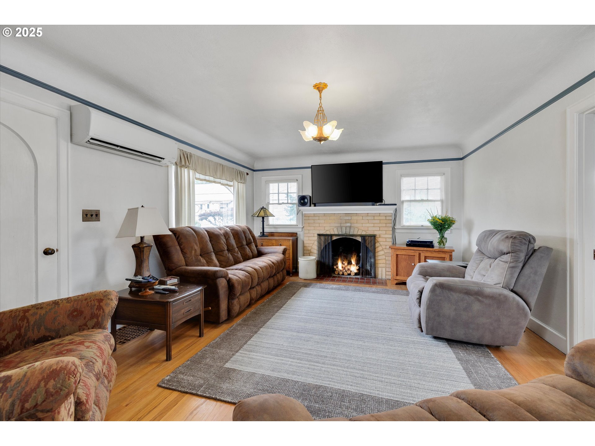 21303 South Central Point Road Oregon City, OR 97045 - Photo 36 of 48 a living room with furniture and a fireplace