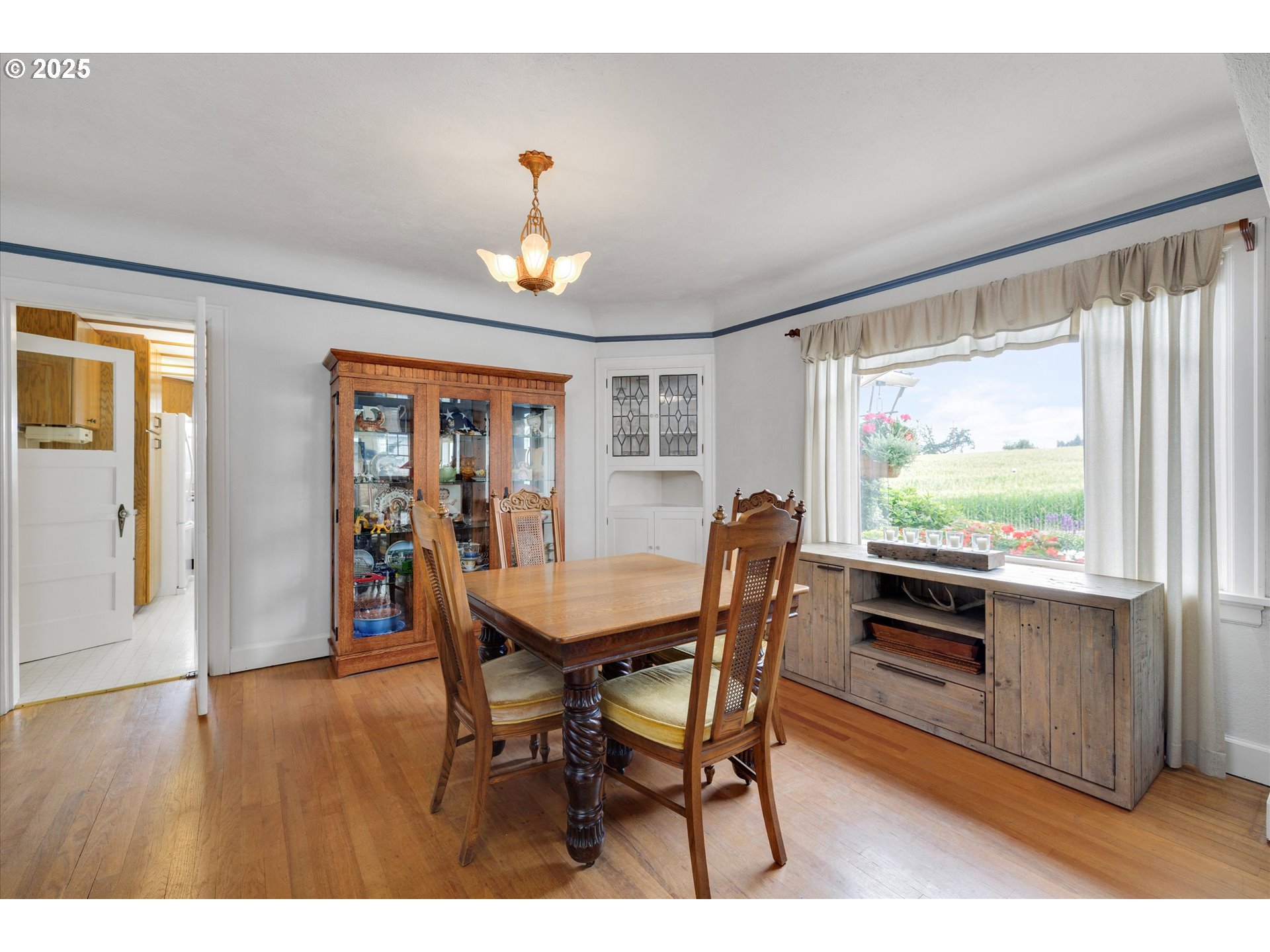 21303 South Central Point Road Oregon City, OR 97045 - Photo 37 of 48 a view of a dining room with furniture window and wooden floor