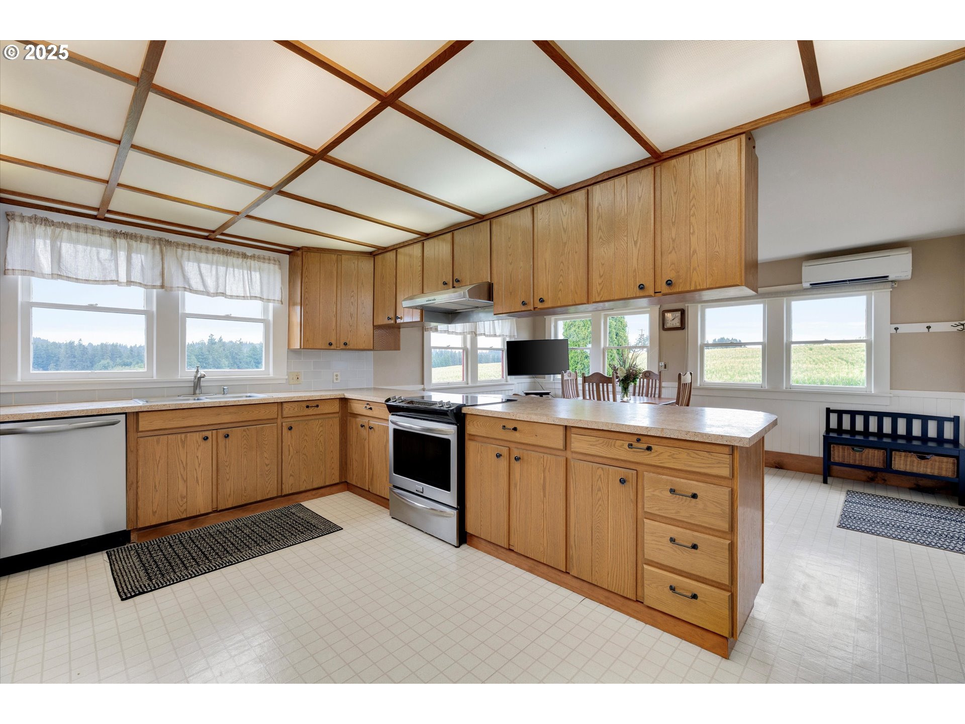 21303 South Central Point Road Oregon City, OR 97045 - Photo 38 of 48 a kitchen with granite countertop a sink cabinets stainless steel appliances and a window