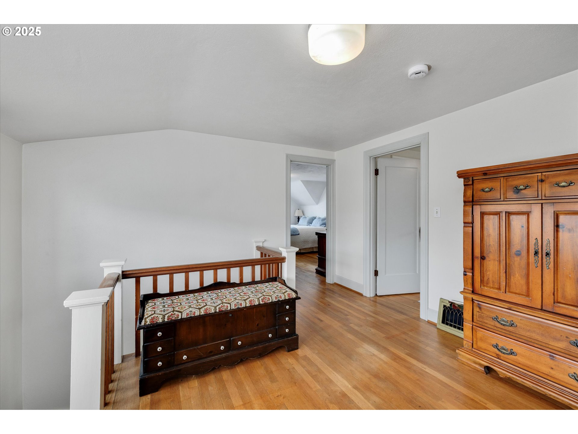 21303 South Central Point Road Oregon City, OR 97045 - Photo 43 of 48 a bedroom with a bed and wooden floor