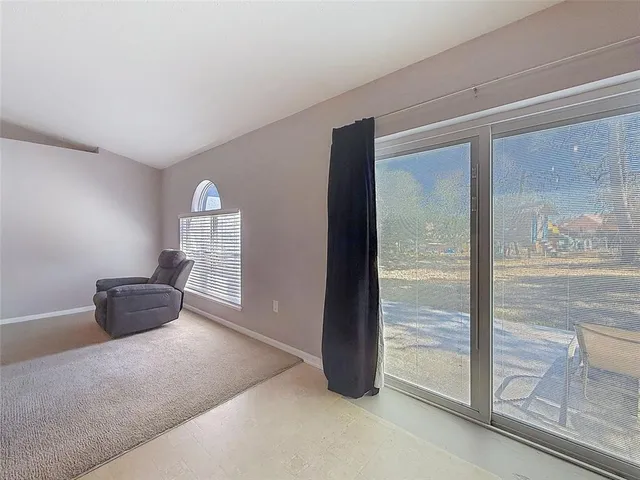 a bedroom with a bed and a ceiling fan