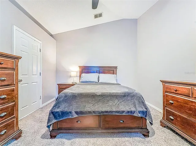 a bedroom with a bed and a cabinets