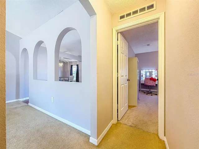 a bedroom with a bed and a bookshelf