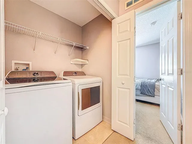 a house view with a sitting space fire pit and outdoor space