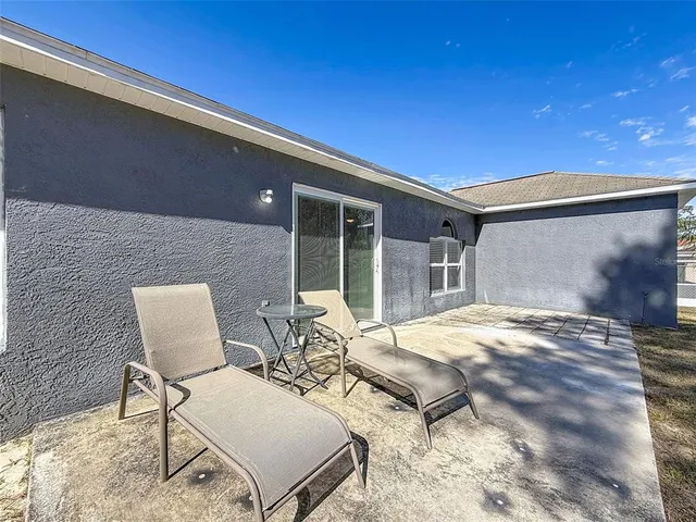 an aerial view of a house with swimming pool