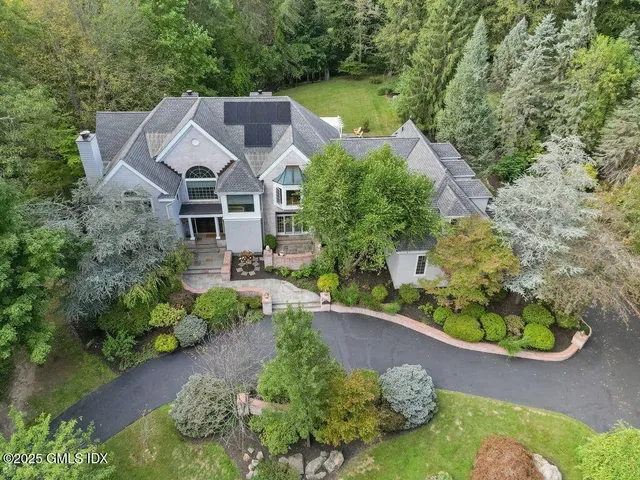 an aerial view of a house with a garden