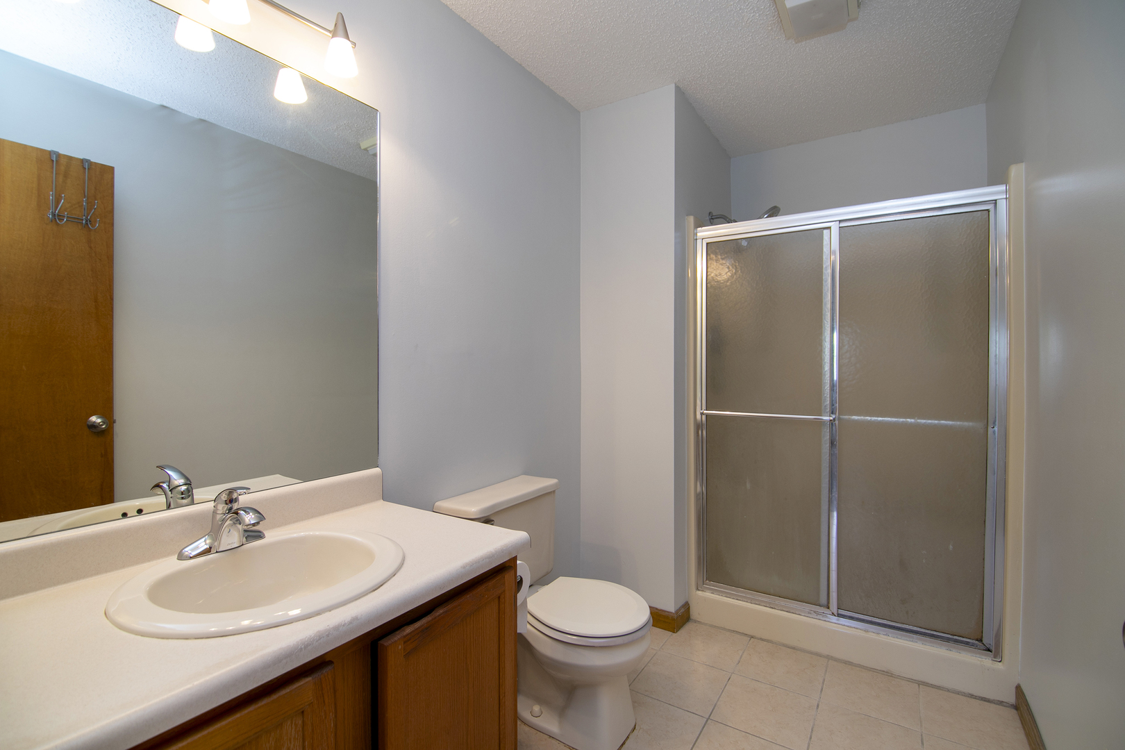 1372 Armour Road, Unit 1372 Bourbonnais, IL 60914 - Photo 11 of 15 a bathroom with a sink toilet and shower