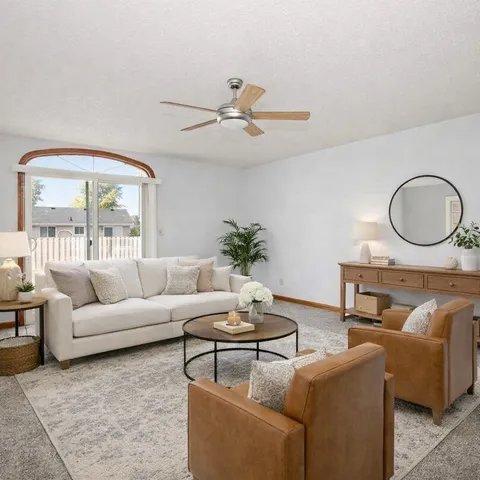 a kitchen with white cabinets and appliances