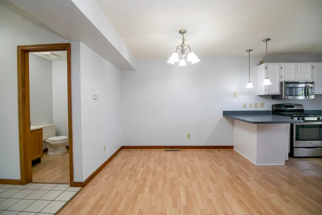 a view of kitchen with sink and wooden floor