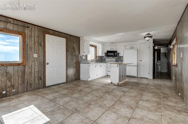 5274 South Yoder Road Yoder, CO 80864 - Photo 4 of 42 LIVING ROOM-KITCHEN COMBO