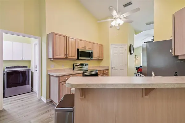 a kitchen with a sink and a bathtub