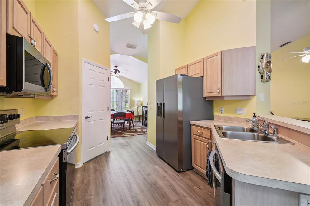 12728 Flamingo Parkway Spring Hill, FL 34610 - Photo 18 of 54 a kitchen with a sink appliances and cabinets