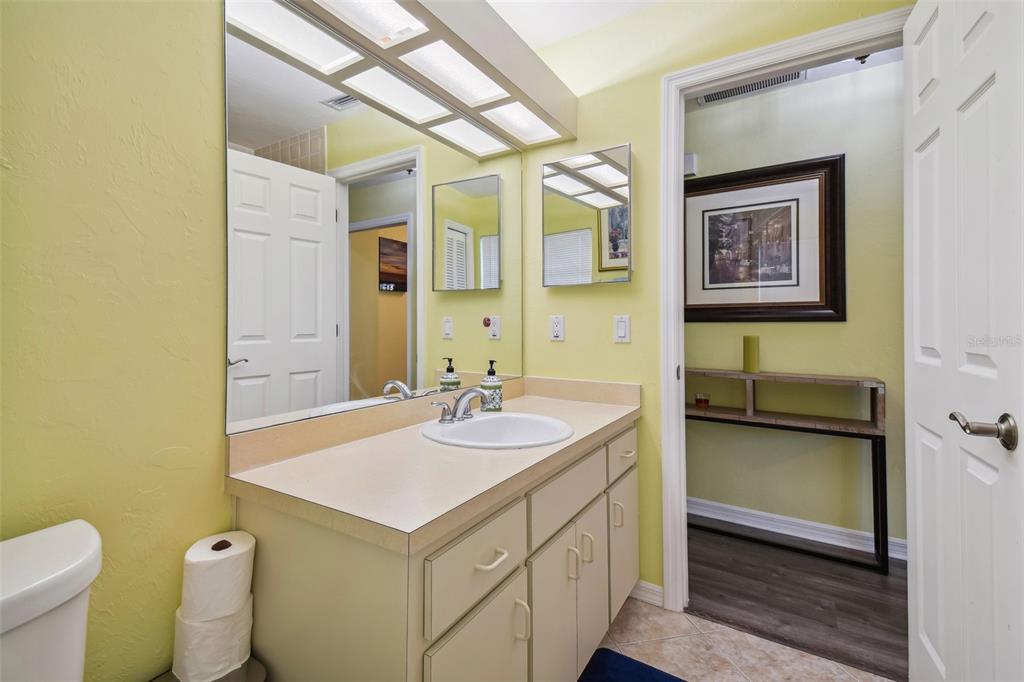 12728 Flamingo Parkway Spring Hill, FL 34610 - Photo 23 of 54 a bathroom with a sink and a mirror