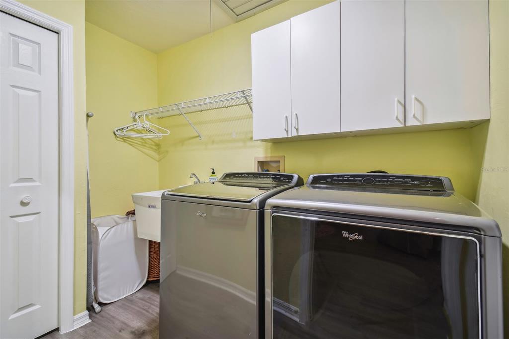 12728 Flamingo Parkway Spring Hill, FL 34610 - Photo 29 of 54 a utility room with dryer and washer