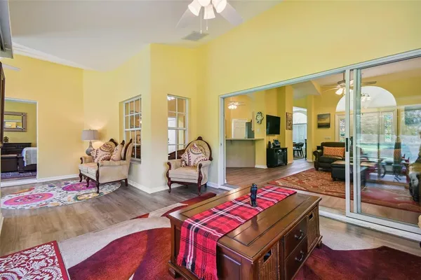 a living room with furniture window and wooden floor